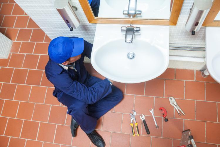 Plumber Under the Sink